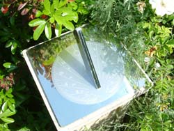 sundial in stainless steel with reflections
