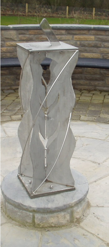 stainless sundial on a "thistle-design" stainless plinth