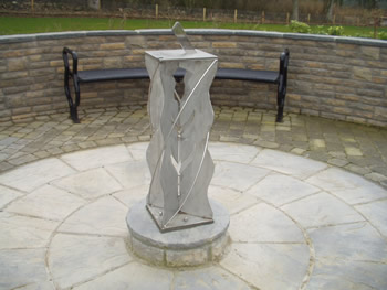 stainless sundial in a cemetery in Scotland